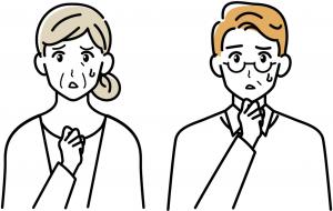 困っている高齢女性と中年男性の息子